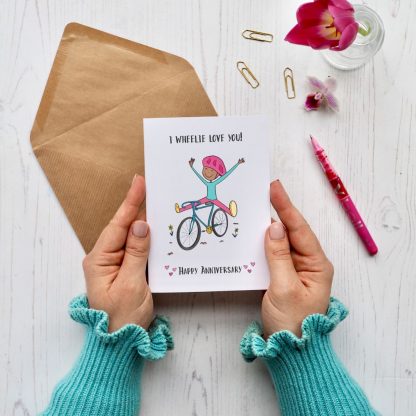 Hands holding Cycling Anniversary Card
