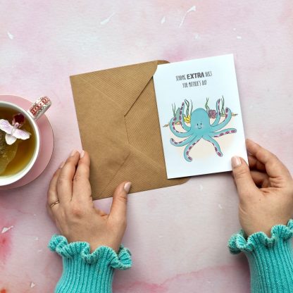 octopus hugs mothers day card being taken out of envelope