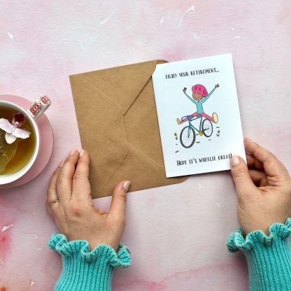 Cyclist retirement card being taken out of envelope
