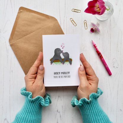 Hands holding Mole Mother's Day card