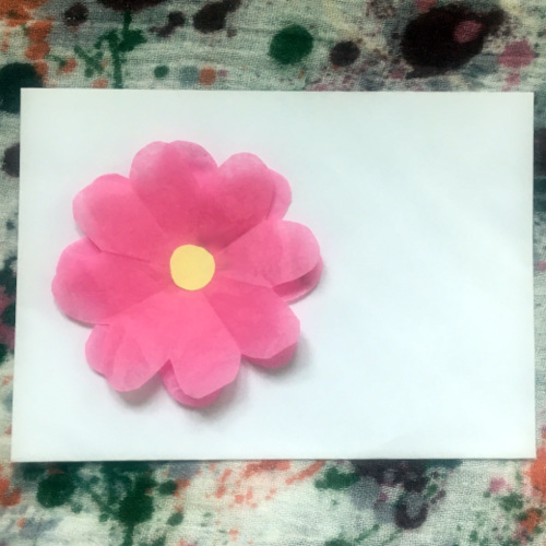decorate an envelope with paper flower